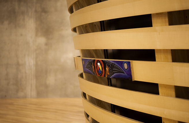 A circular theatre of curved wooden slats, the central focal point in the Indigenous Perspectives gallery, represents the multitude of Canadian Aboriginal traditions.