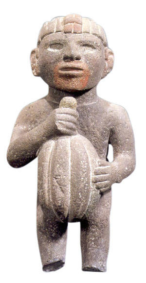 Aztec sculpture of a man holding a cacao bean
