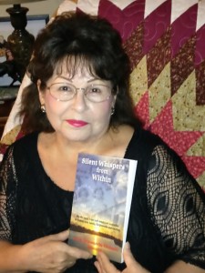 Author June Shawanda Richard with her self-published book of memoirs, Silent Whispers from Within