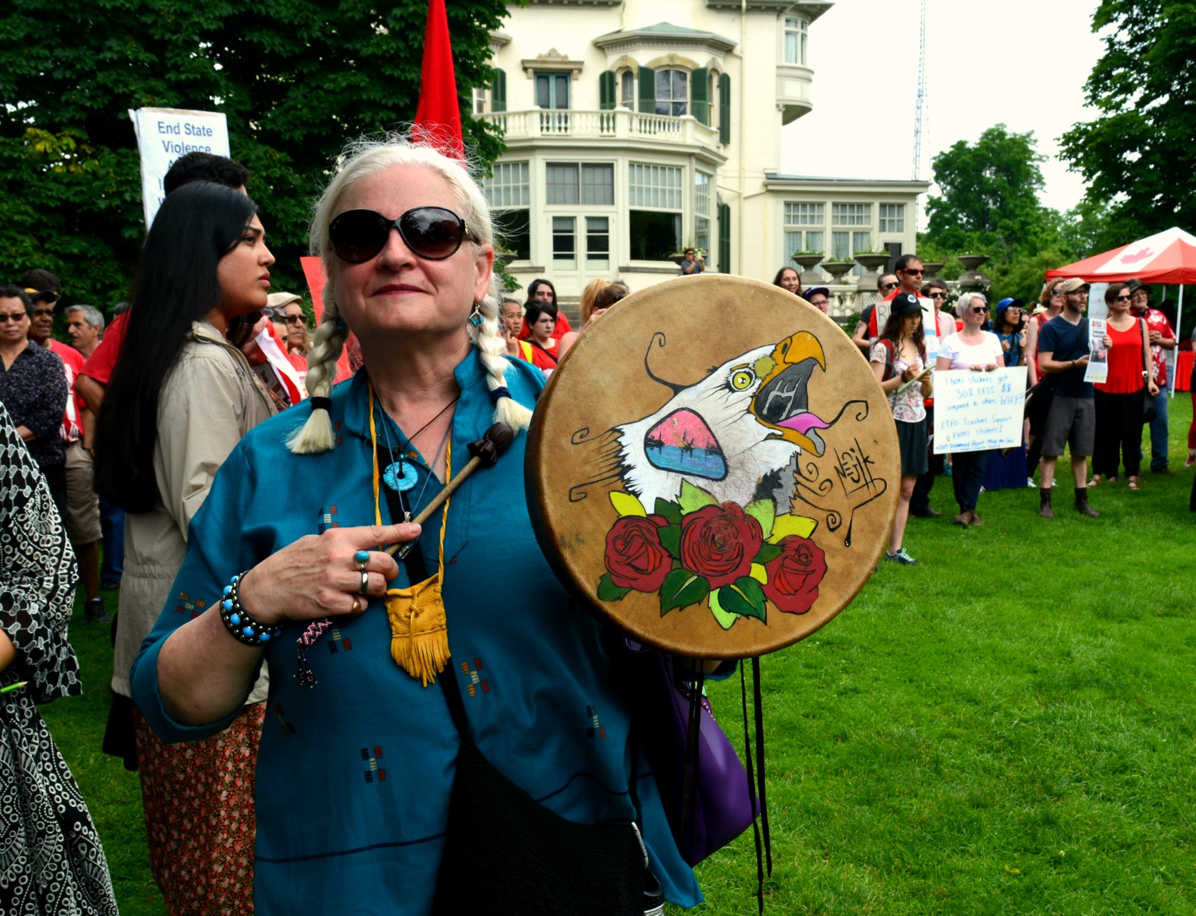 Protester with a beautiful hand painted drum